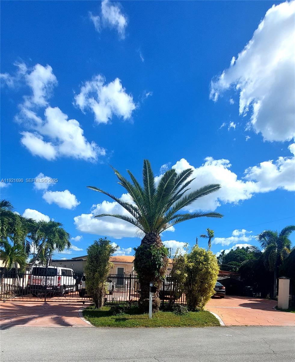 a view of a street with a building in the background
