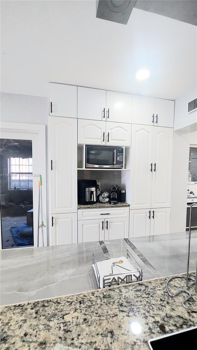 2145 Southwest 76th Avenue Miami, FL 33155 - Photo 11 of 28 a living room with furniture and a flat screen tv