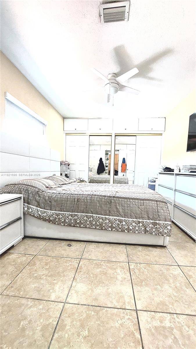 2145 Southwest 76th Avenue Miami, FL 33155 - Photo 16 of 28 a living room with a couch and a stove