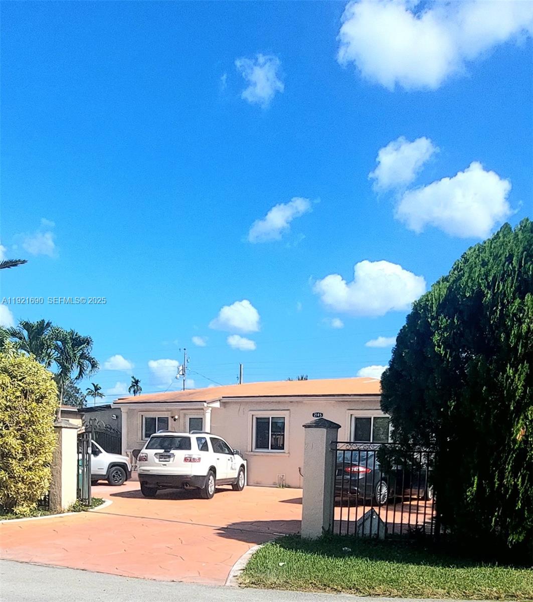 2145 Southwest 76th Avenue Miami, FL 33155 - Photo 2 of 28 a view of a house with swimming pool and yard
