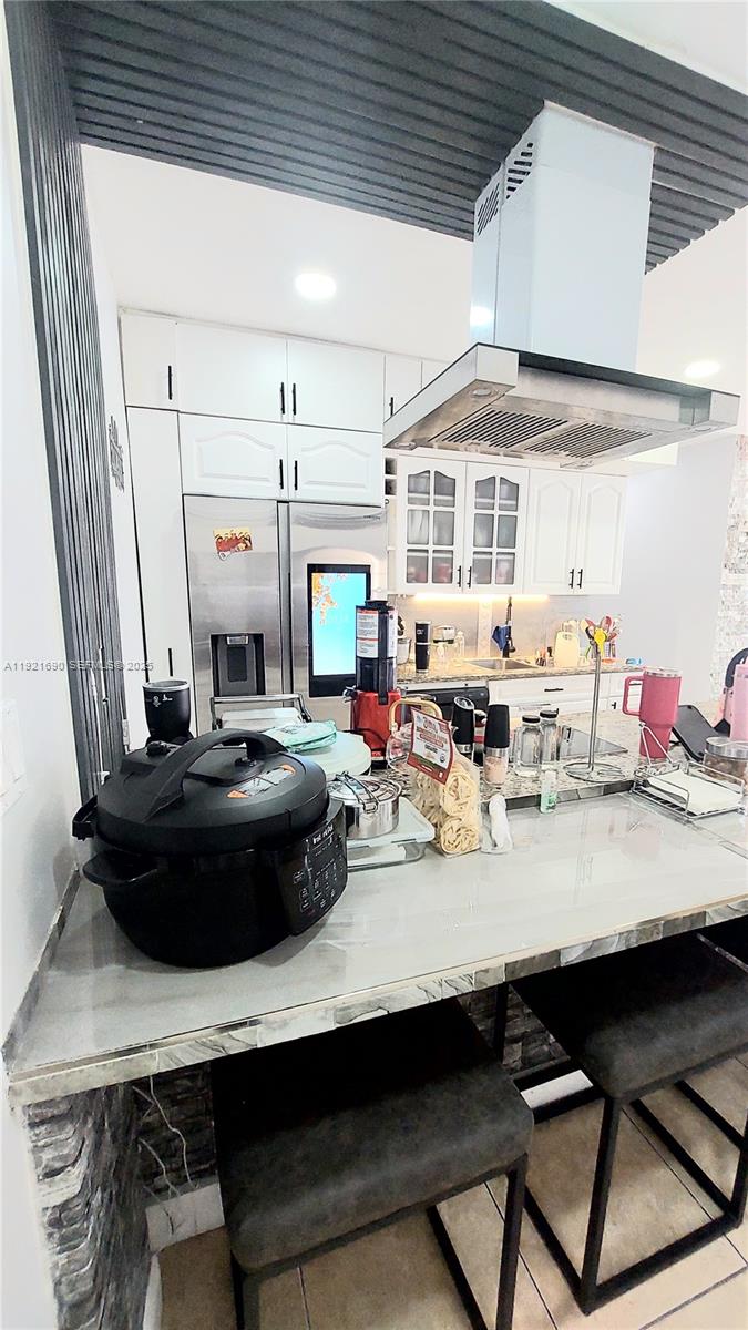 2145 Southwest 76th Avenue Miami, FL 33155 - Photo 22 of 28 a kitchen with a table and chairs