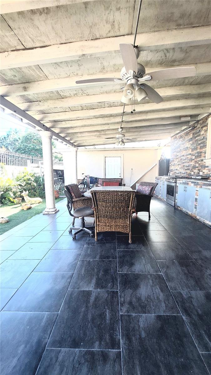 2145 Southwest 76th Avenue Miami, FL 33155 - Photo 25 of 28 a living room with furniture and a floor to ceiling window