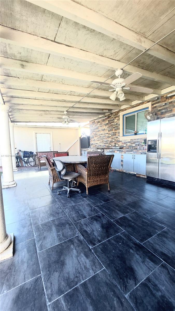 2145 Southwest 76th Avenue Miami, FL 33155 - Photo 28 of 28 a living room with couches and kitchen view with wooden floor