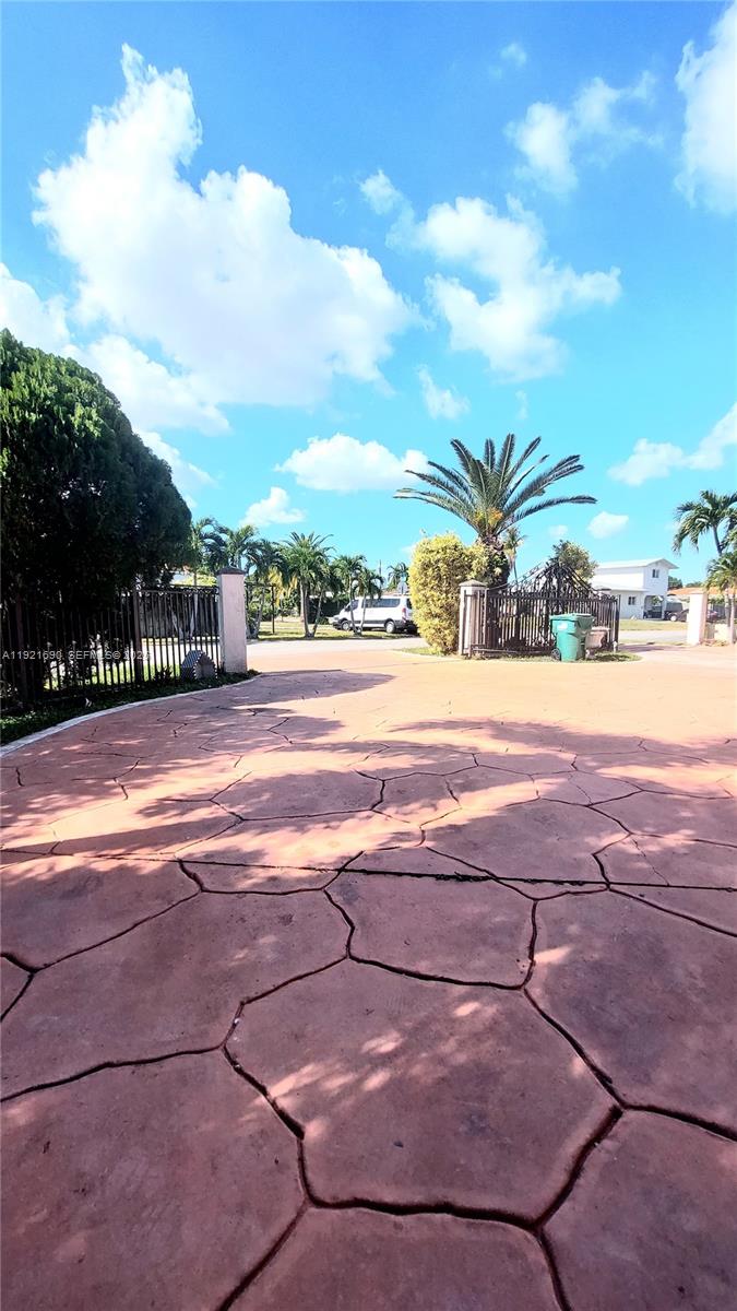 2145 Southwest 76th Avenue Miami, FL 33155 - Photo 7 of 28 a backyard of a house with table and chairs