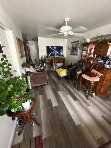 a room with wooden floor and furniture