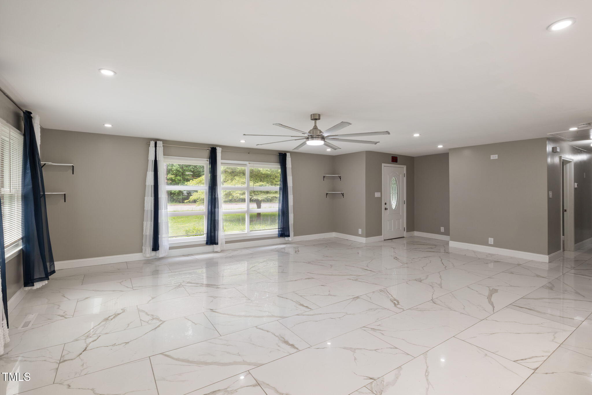 2315 Oxford Road Henderson, NC 27536 - Photo 11 of 62 a view of an empty room with a window