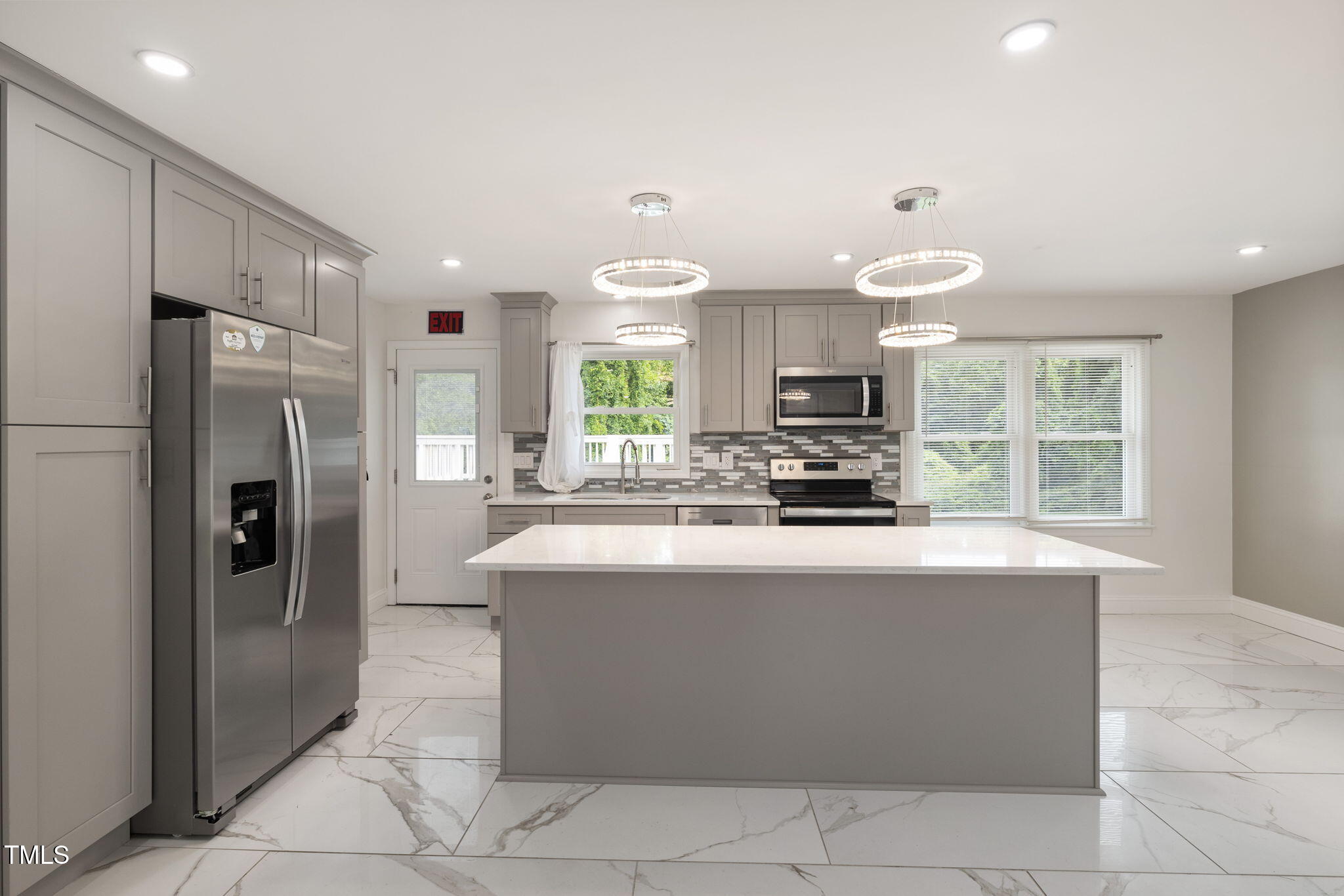 2315 Oxford Road Henderson, NC 27536 - Photo 12 of 62 a kitchen with stainless steel appliances granite countertop a refrigerator a stove a sink and a refrigerator
