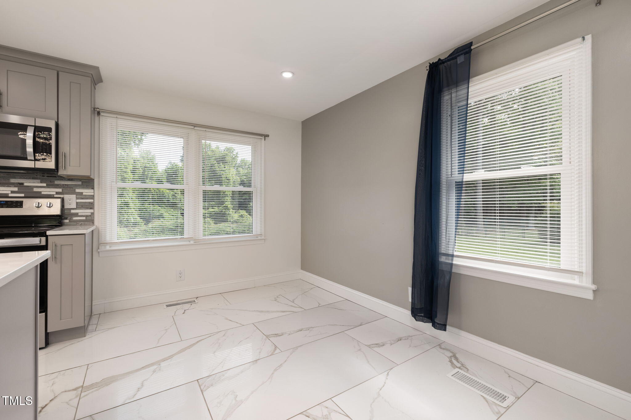 2315 Oxford Road Henderson, NC 27536 - Photo 14 of 62 a view of an empty room with a window