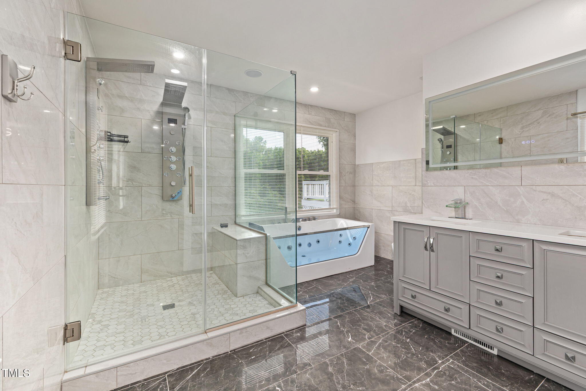 2315 Oxford Road Henderson, NC 27536 - Photo 18 of 62 a bathroom with a shower sink and mirror