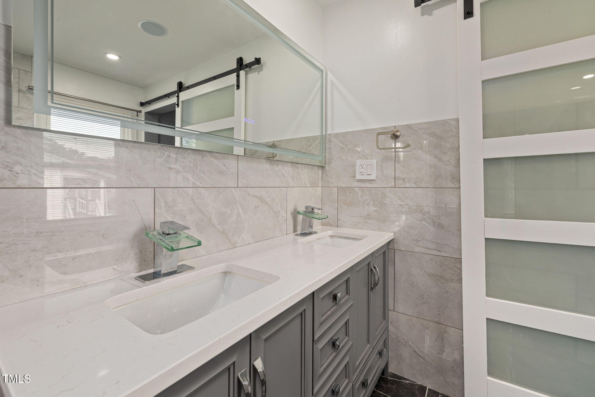 2315 Oxford Road Henderson, NC 27536 - Photo 19 of 62 a bathroom with a sink and a shower