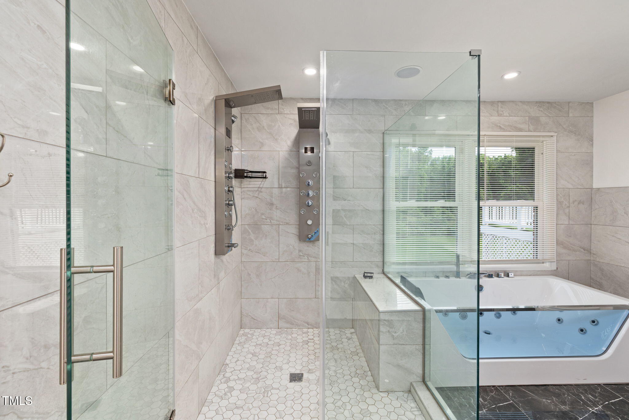 2315 Oxford Road Henderson, NC 27536 - Photo 25 of 62 a bathroom with a glass shower door and a sink