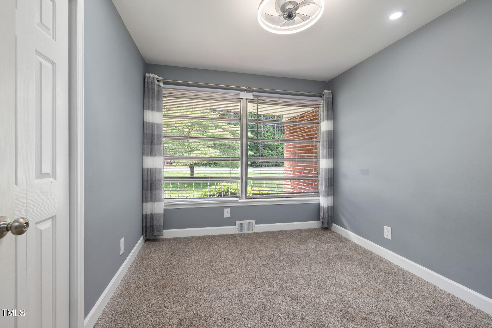 2315 Oxford Road Henderson, NC 27536 - Photo 26 of 62 a view of room with window and a porch