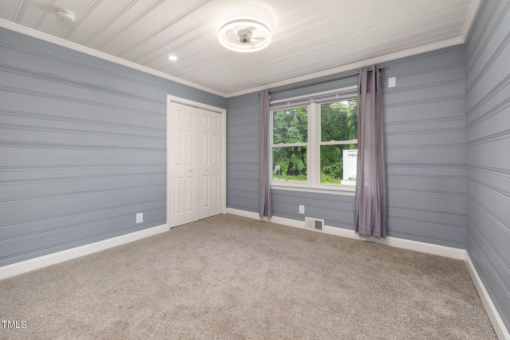 2315 Oxford Road Henderson, NC 27536 - Photo 27 of 62 a view of an empty room with a window