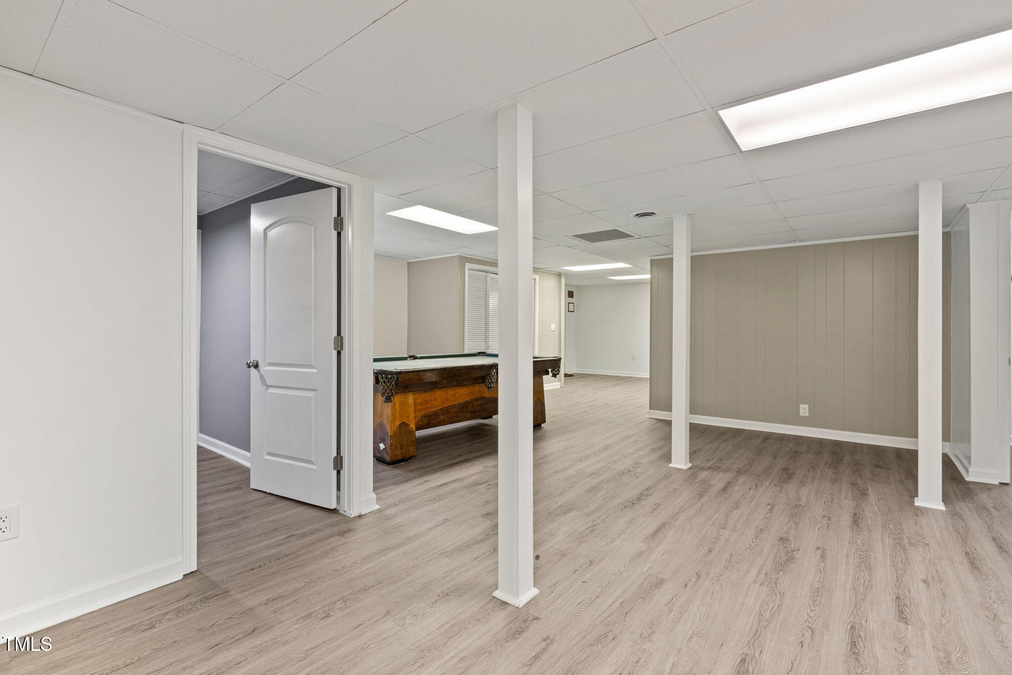 2315 Oxford Road Henderson, NC 27536 - Photo 35 of 62 a view of empty room with wooden floor