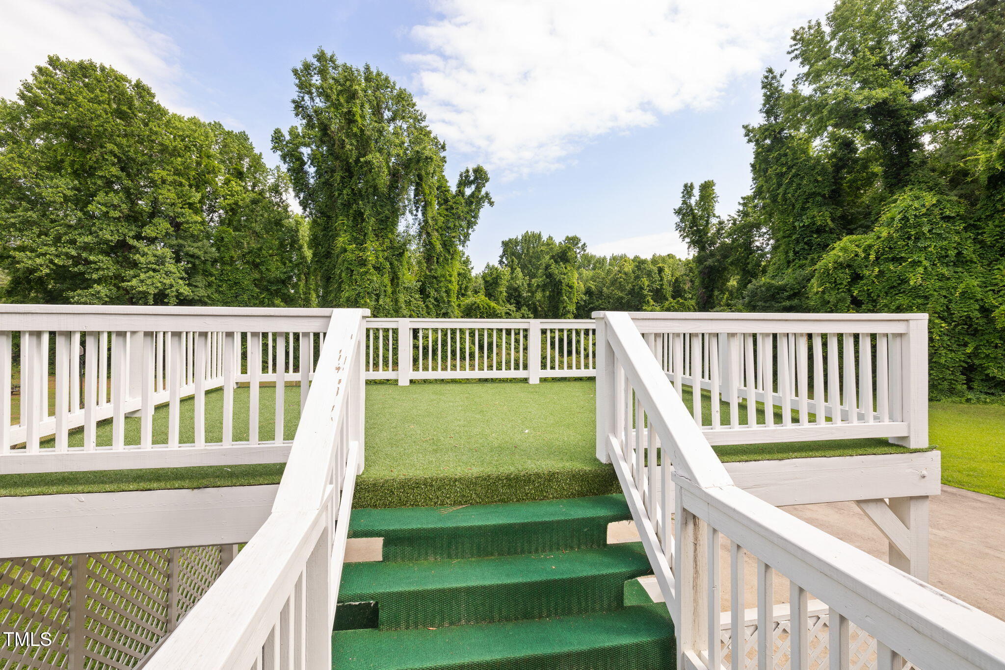 2315 Oxford Road Henderson, NC 27536 - Photo 48 of 62 a view of a wooden deck and a backyard