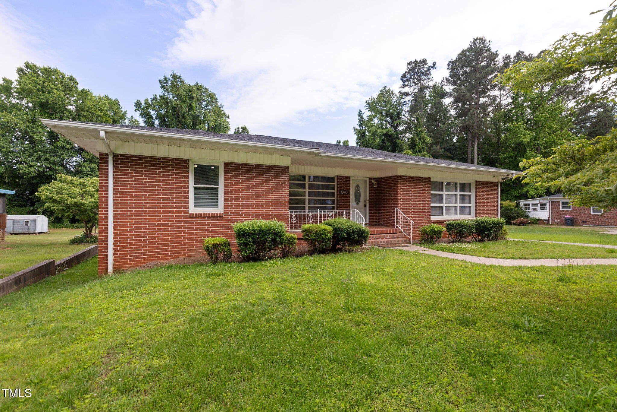 2315 Oxford Road Henderson, NC 27536 - Photo 3 of 62 a view of a house with a backyard