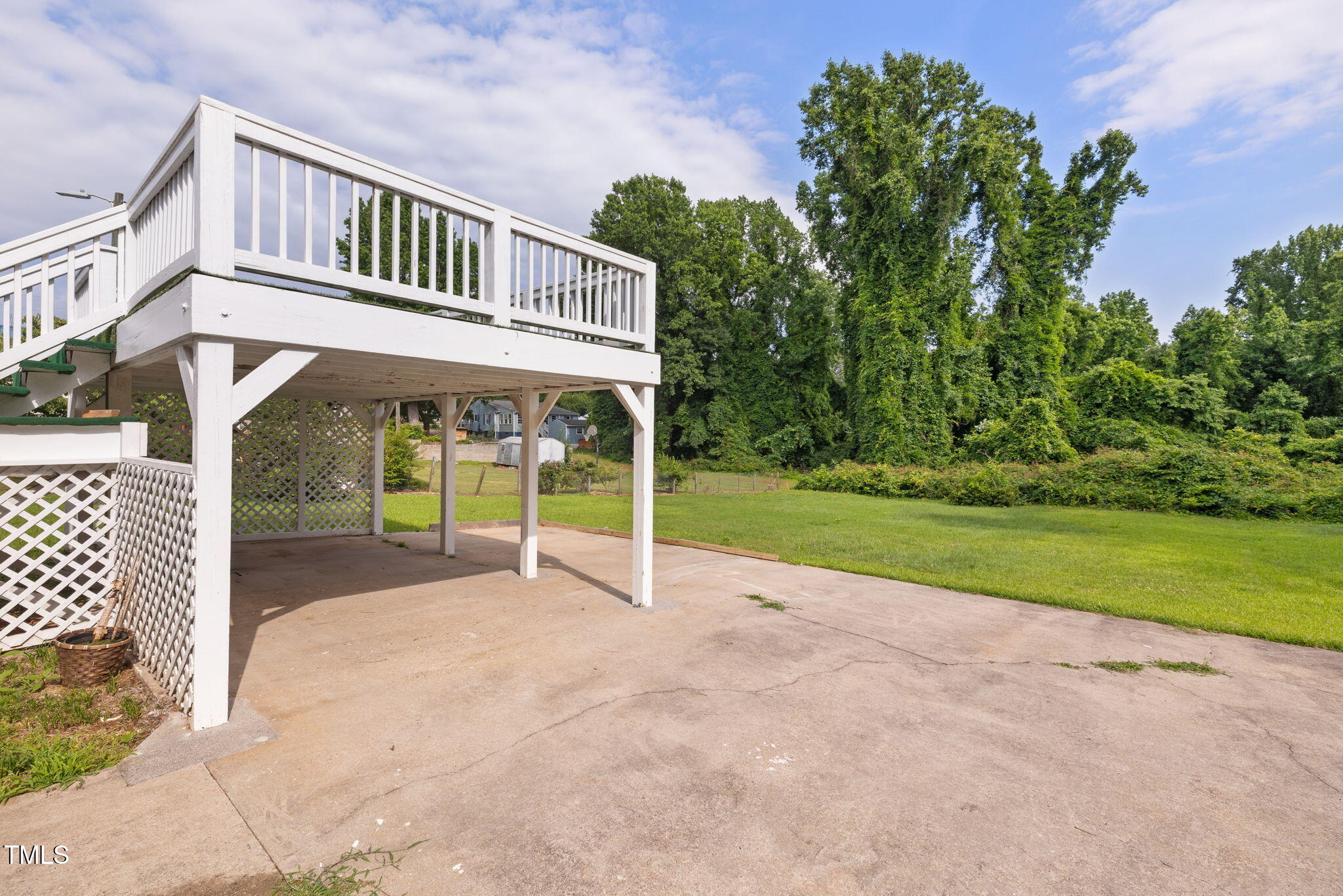 2315 Oxford Road Henderson, NC 27536 - Photo 50 of 62 a view of a house with a yard and deck