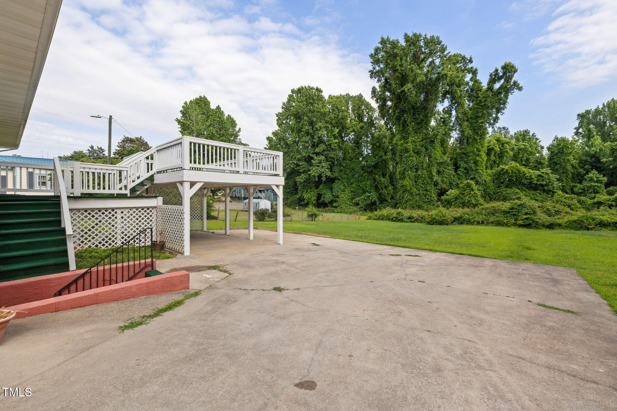 2315 Oxford Road Henderson, NC 27536 - Photo 52 of 62 a view of a house with backyard and porch