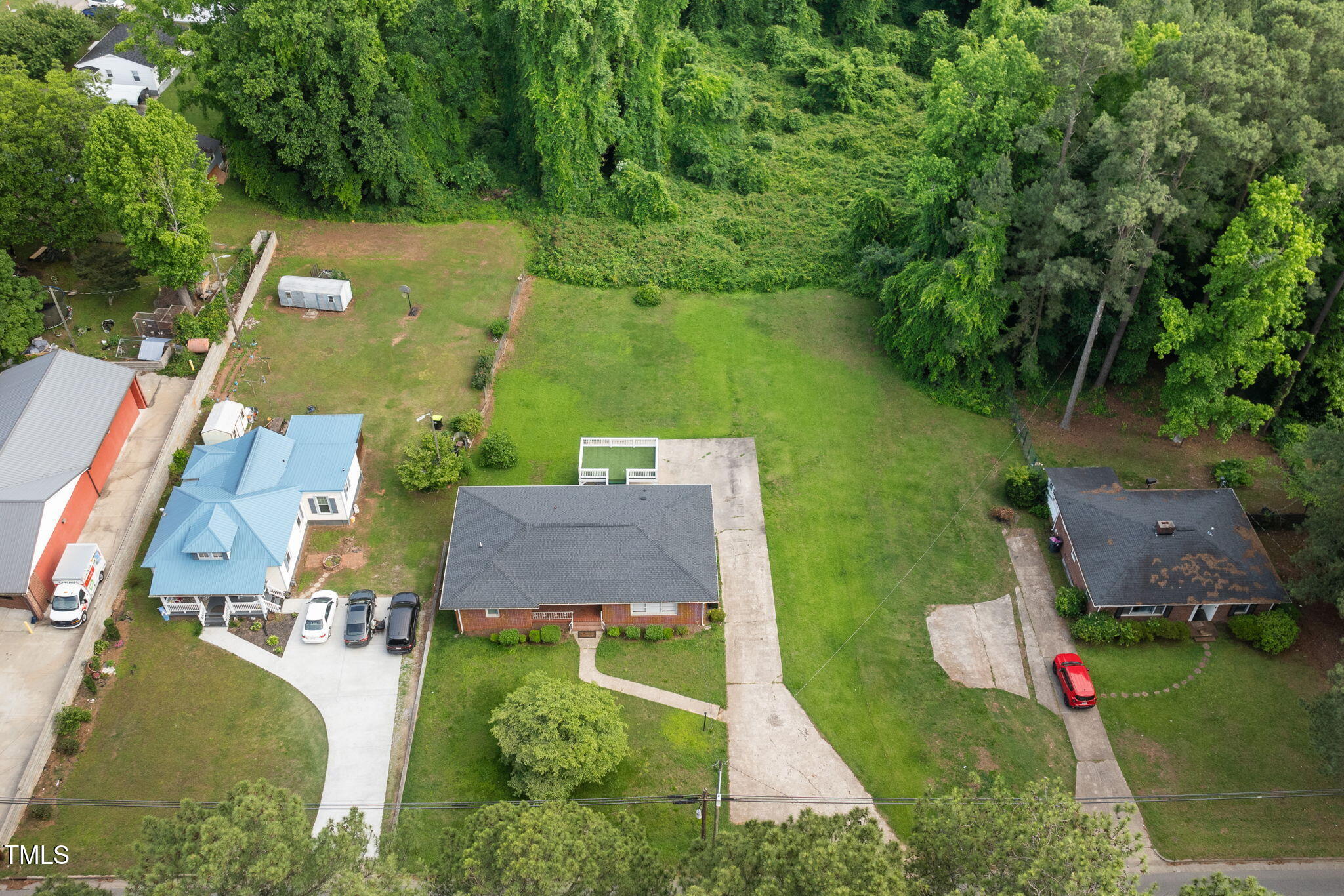 2315 Oxford Road Henderson, NC 27536 - Photo 56 of 62 an aerial view of residential houses with outdoor space and swimming pool