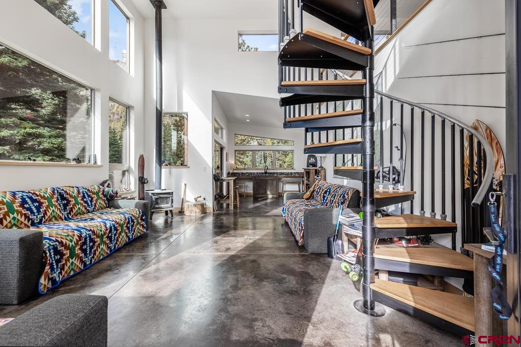 448 Hermosa View Drive Durango, CO 81301 - Photo 12 of 42 a view of living room with furniture and book shelf