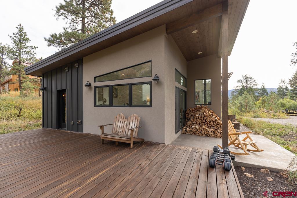 448 Hermosa View Drive Durango, CO 81301 - Photo 15 of 42 a balcony with wooden floor table and chairs