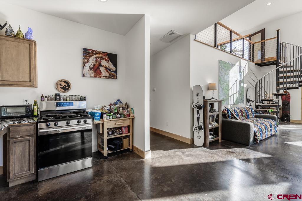 448 Hermosa View Drive Durango, CO 81301 - Photo 17 of 42 a kitchen with stainless steel appliances granite countertop a stove and a refrigerator