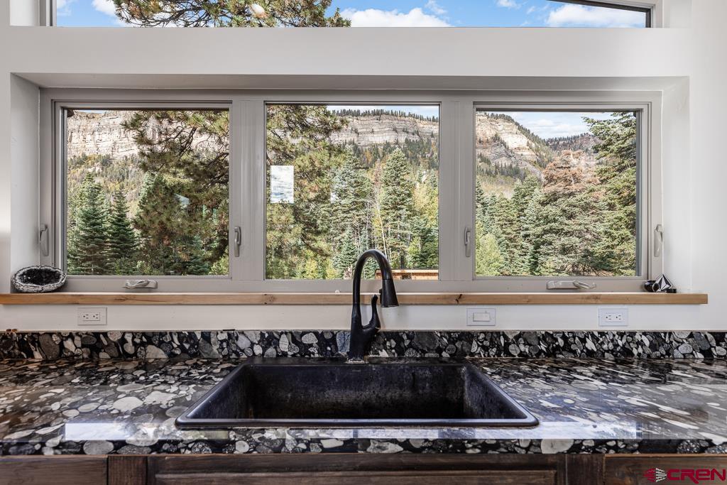 448 Hermosa View Drive Durango, CO 81301 - Photo 19 of 42 a kitchen with a stove a sink and a window