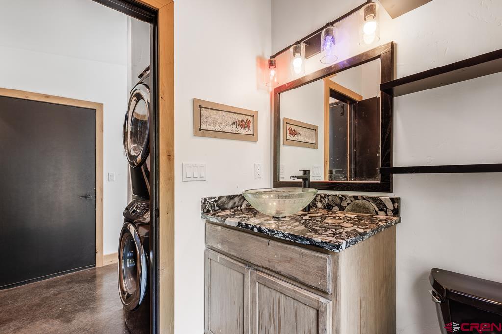 448 Hermosa View Drive Durango, CO 81301 - Photo 21 of 42 a bathroom with a granite countertop sink and a mirror