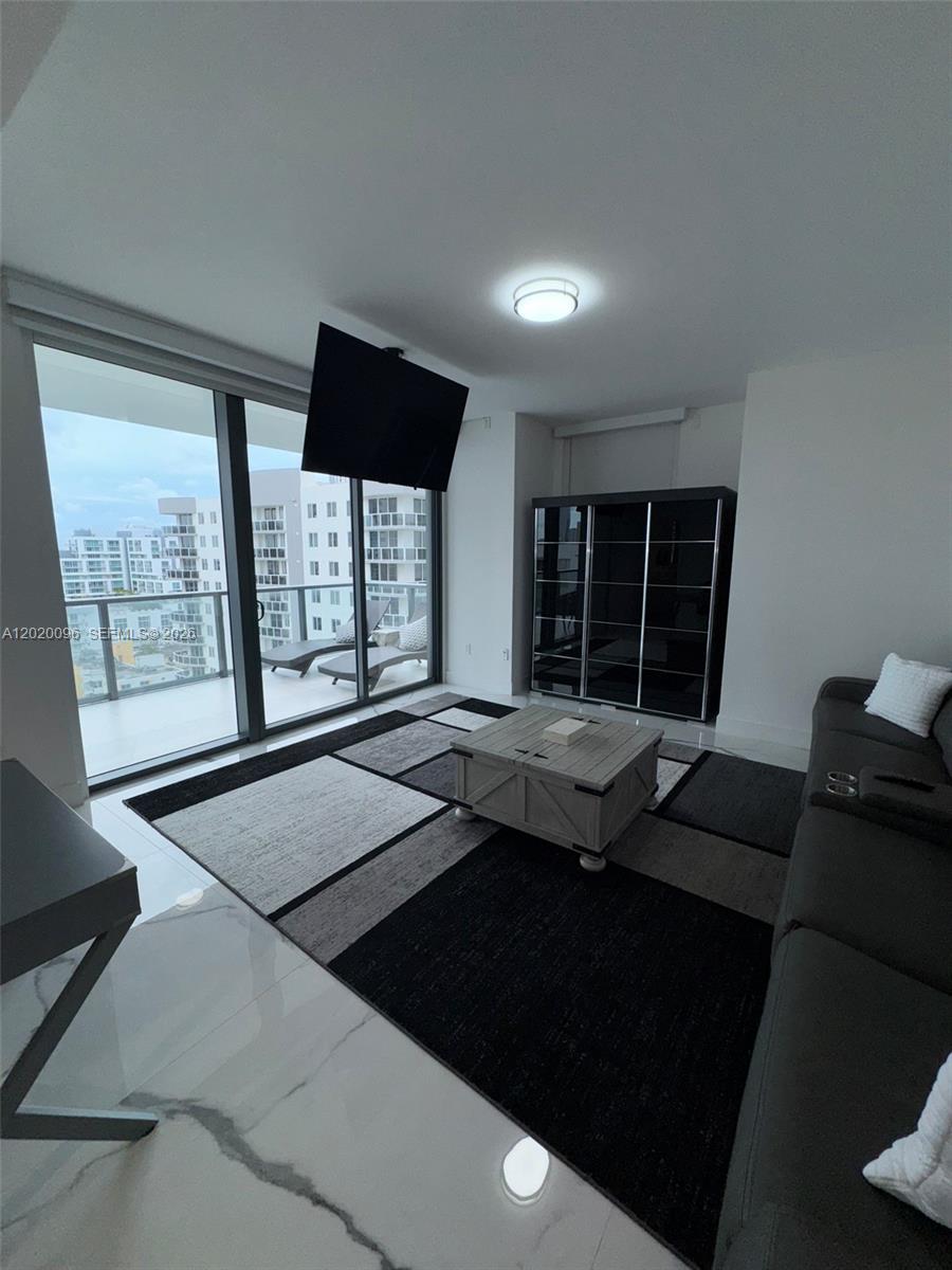 788 Northeast 23rd Street, Unit 1202 Miami, FL 33137 - Photo 35 of 64 a view of a livingroom with furniture and window