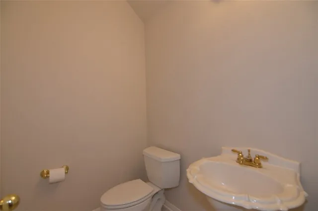 a bathroom with a toilet and sink