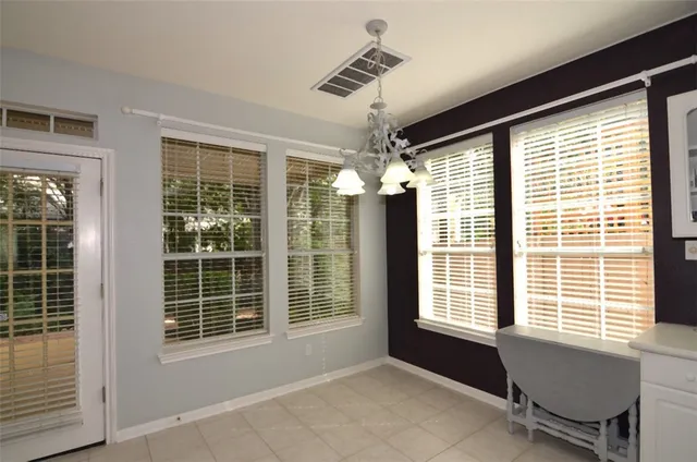 a view of a livingroom with furniture and windows