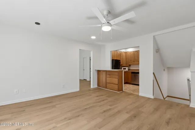a kitchen with stainless steel appliances a stove a microwave and cabinets