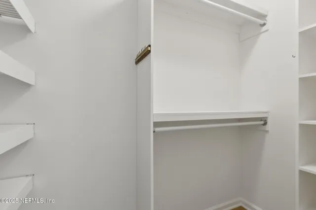 a bathroom with a toilet a sink a vanity and mirror