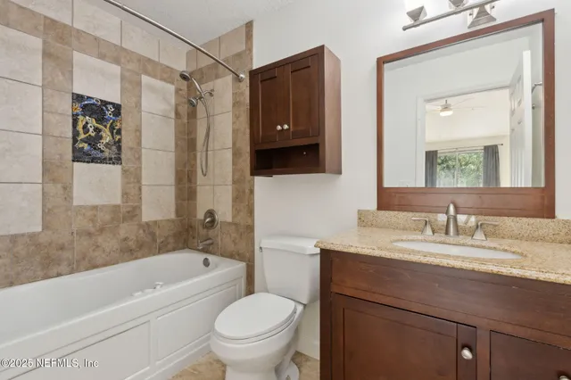 an empty room with closet and windows