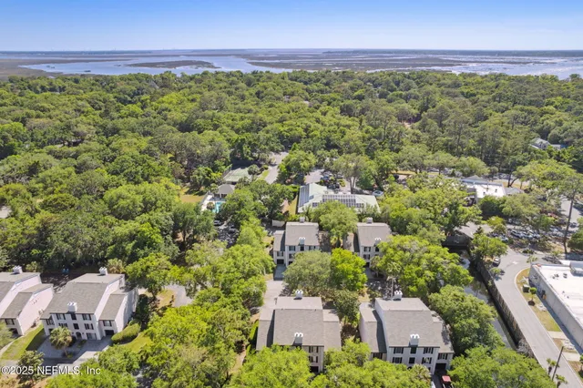 a view of a swimming pool with a patio and a yard