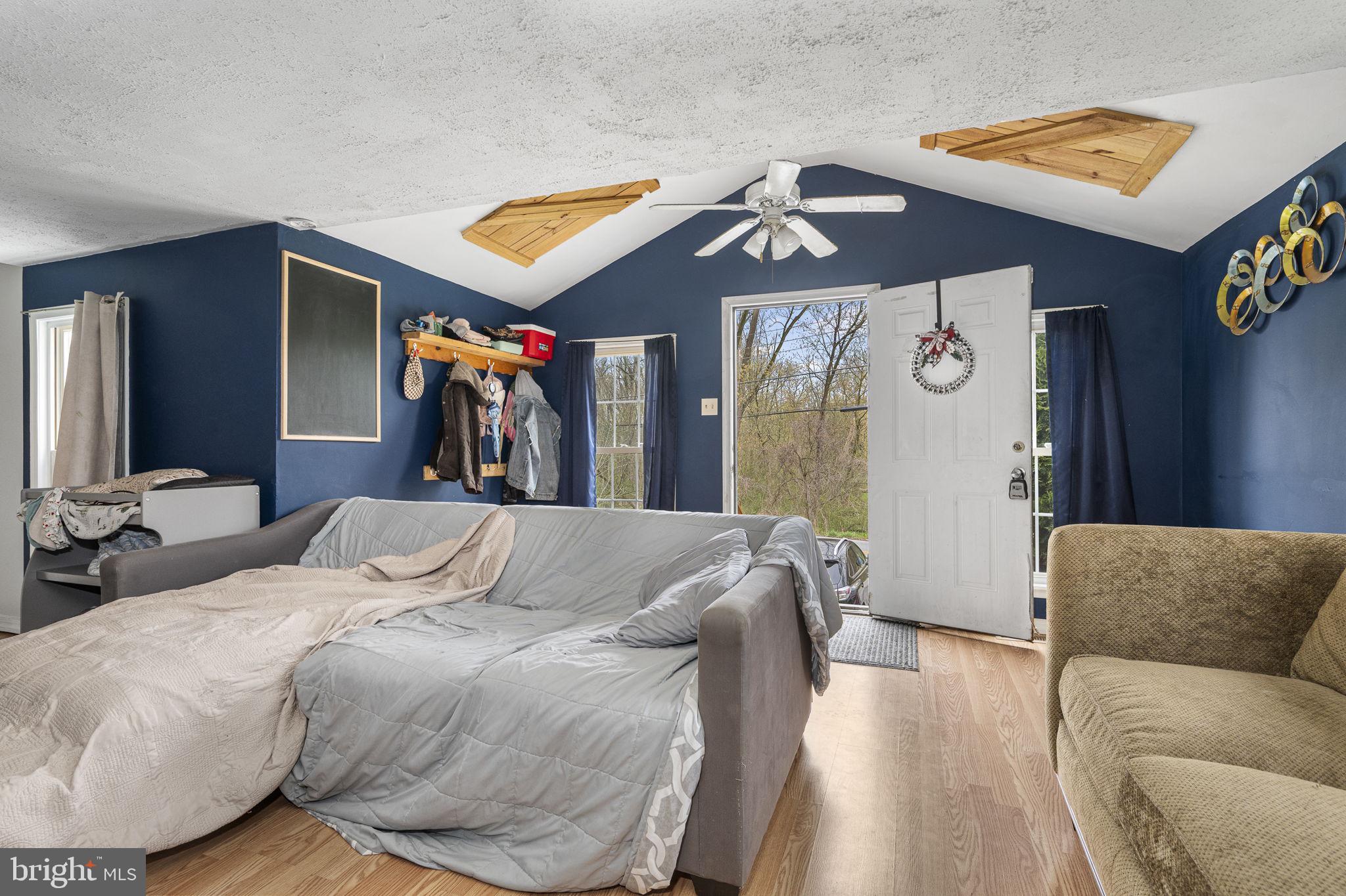 102 Paschall Mill Road West Grove, PA 19390 - Photo 12 of 29 a bedroom with a bed and wooden floor