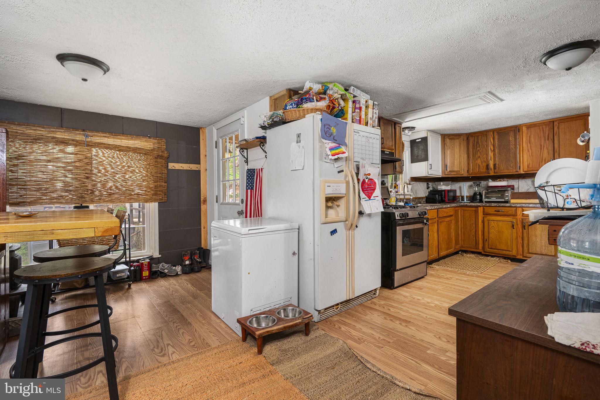 102 Paschall Mill Road West Grove, PA 19390 - Photo 17 of 29 a view of a kitchen with fridge and workspace