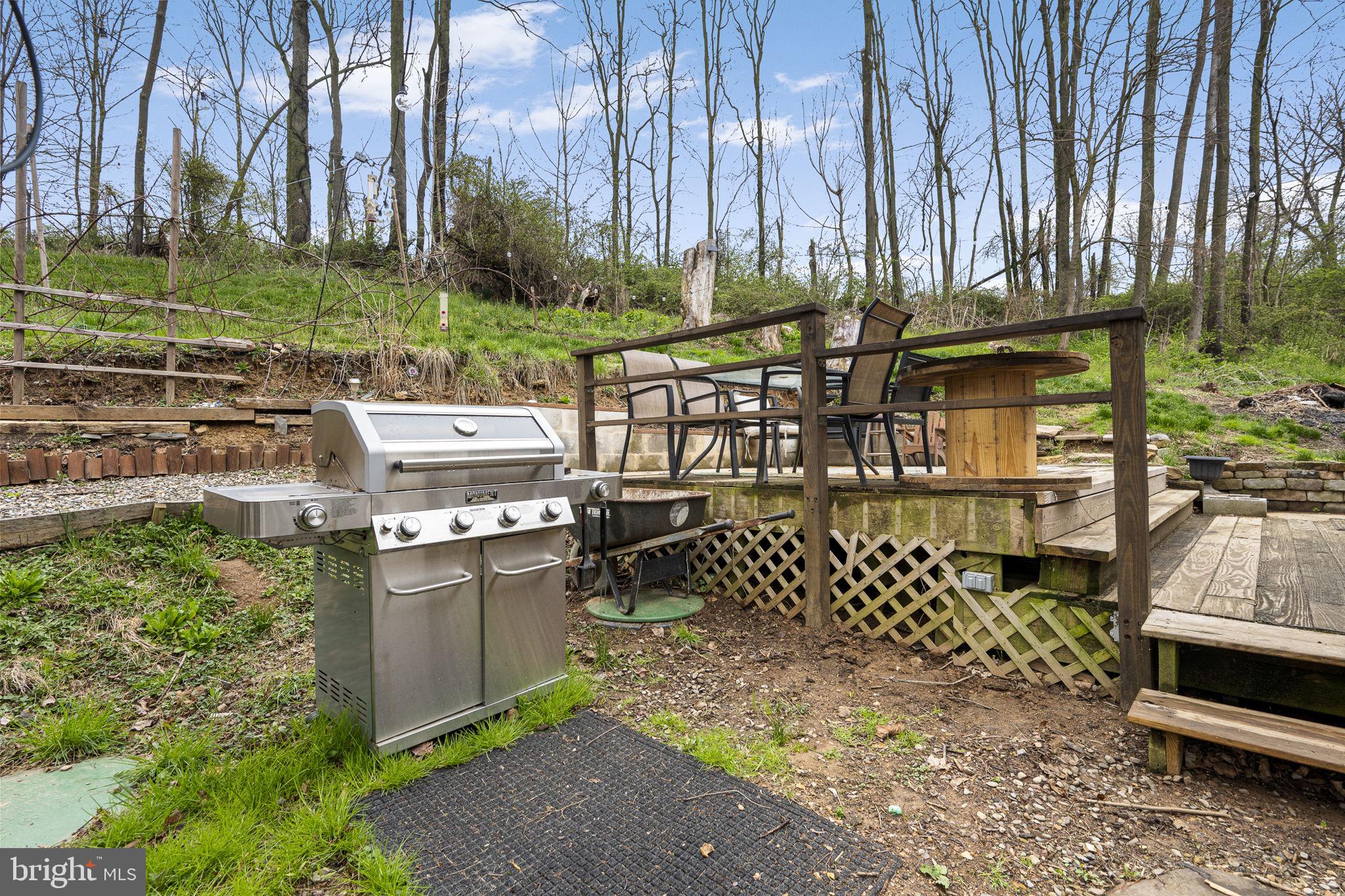 102 Paschall Mill Road West Grove, PA 19390 - Photo 23 of 29 a view of a chairs and table in the backyard