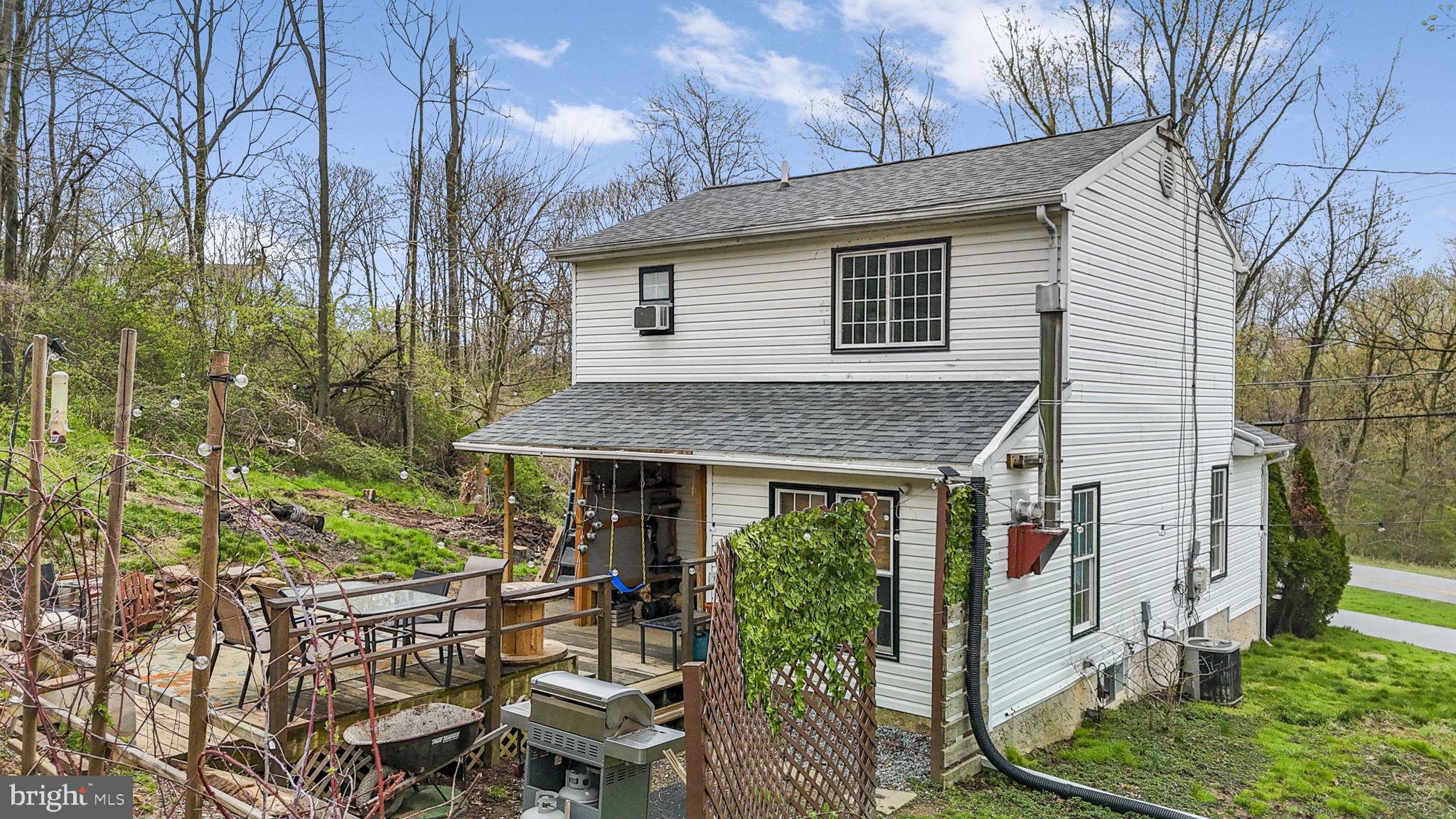 102 Paschall Mill Road West Grove, PA 19390 - Photo 7 of 29 a view of a house with patio