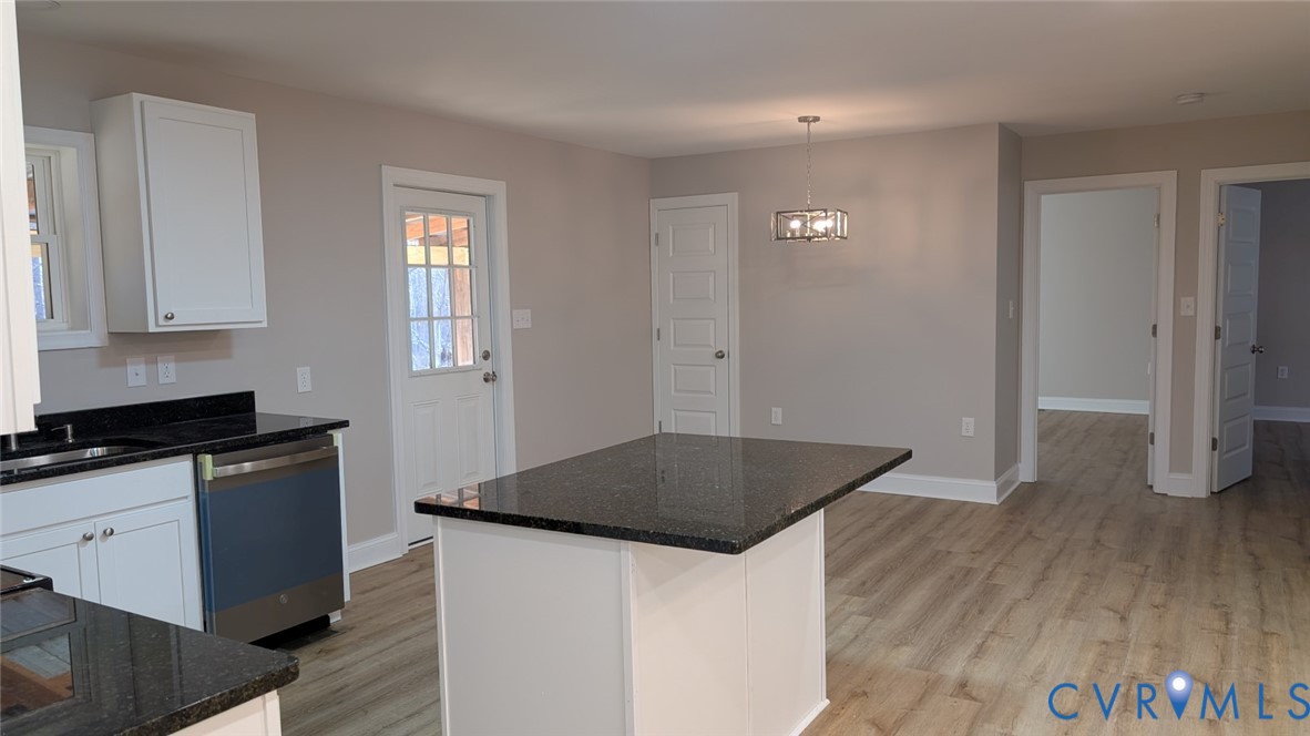 19201 Genito Road Amelia Court House, VA 23002 - Photo 7 of 27 Kitchen with a center island, dark stone counterto