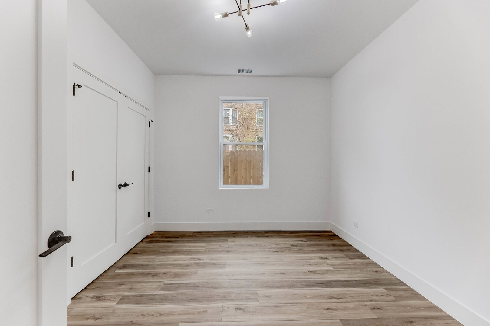 5921 South Calumet Avenue, Unit 2 Chicago, IL 60637 - Photo 19 of 40 a view of an empty room with a window