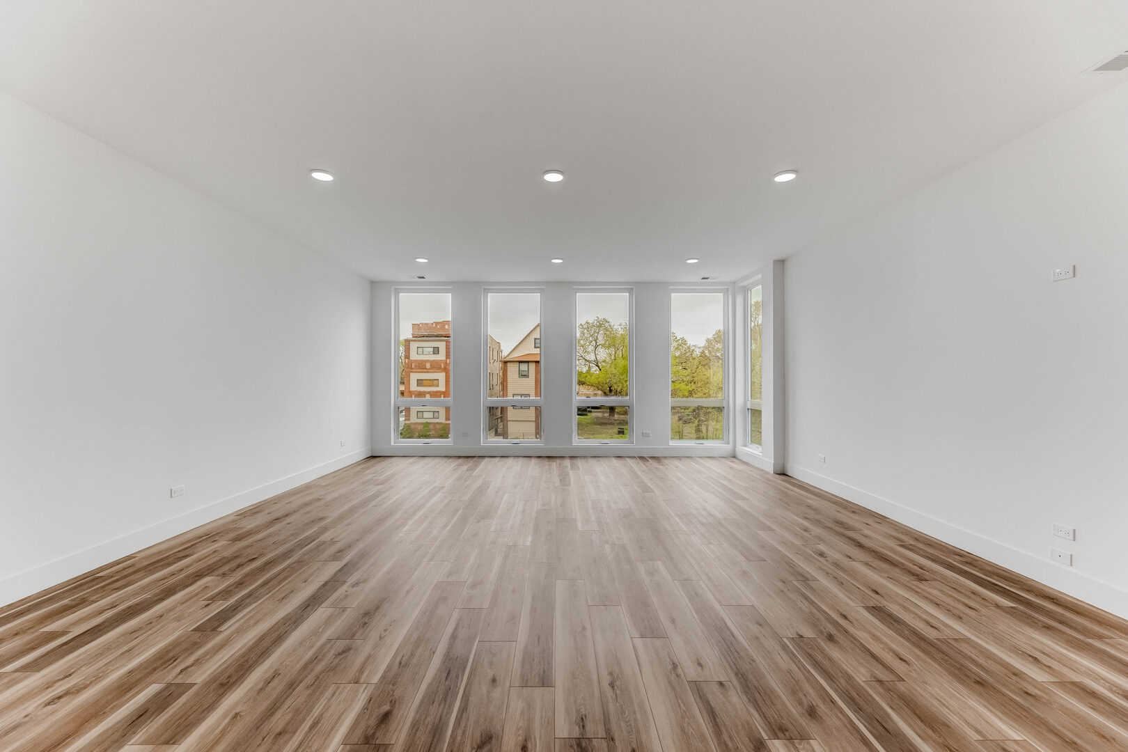 5921 South Calumet Avenue, Unit 2 Chicago, IL 60637 - Photo 23 of 40 a view of an empty room with wooden floor and window