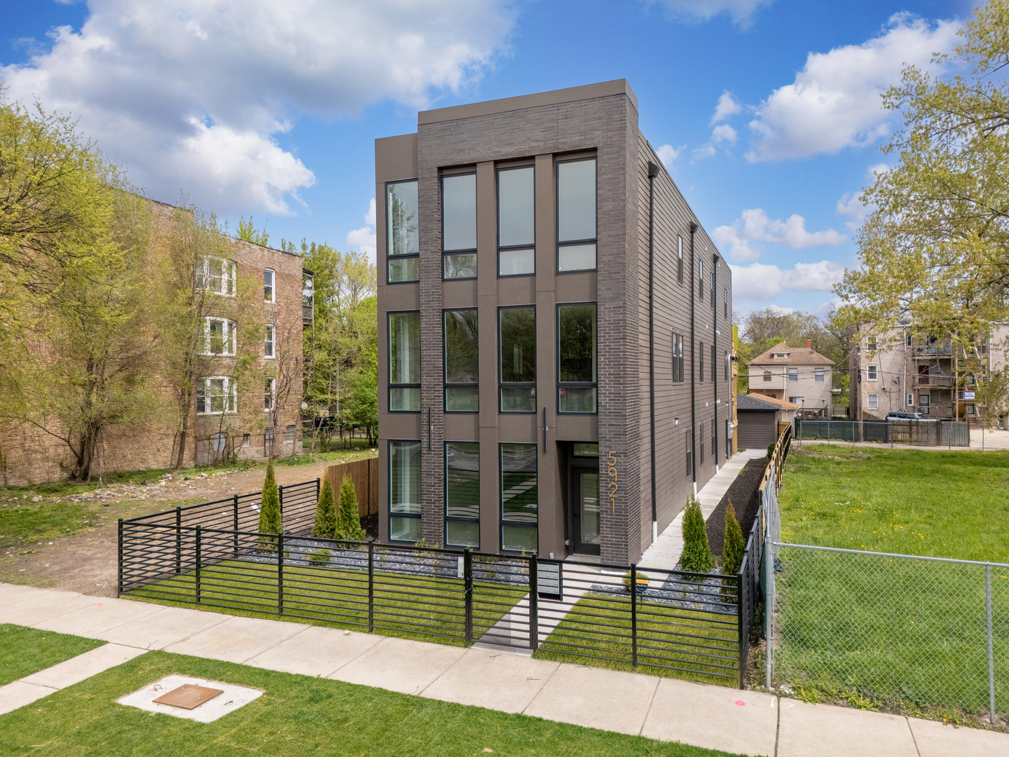 5921 South Calumet Avenue, Unit 2 Chicago, IL 60637 - Photo 3 of 40 a view of a brick building next to a yard
