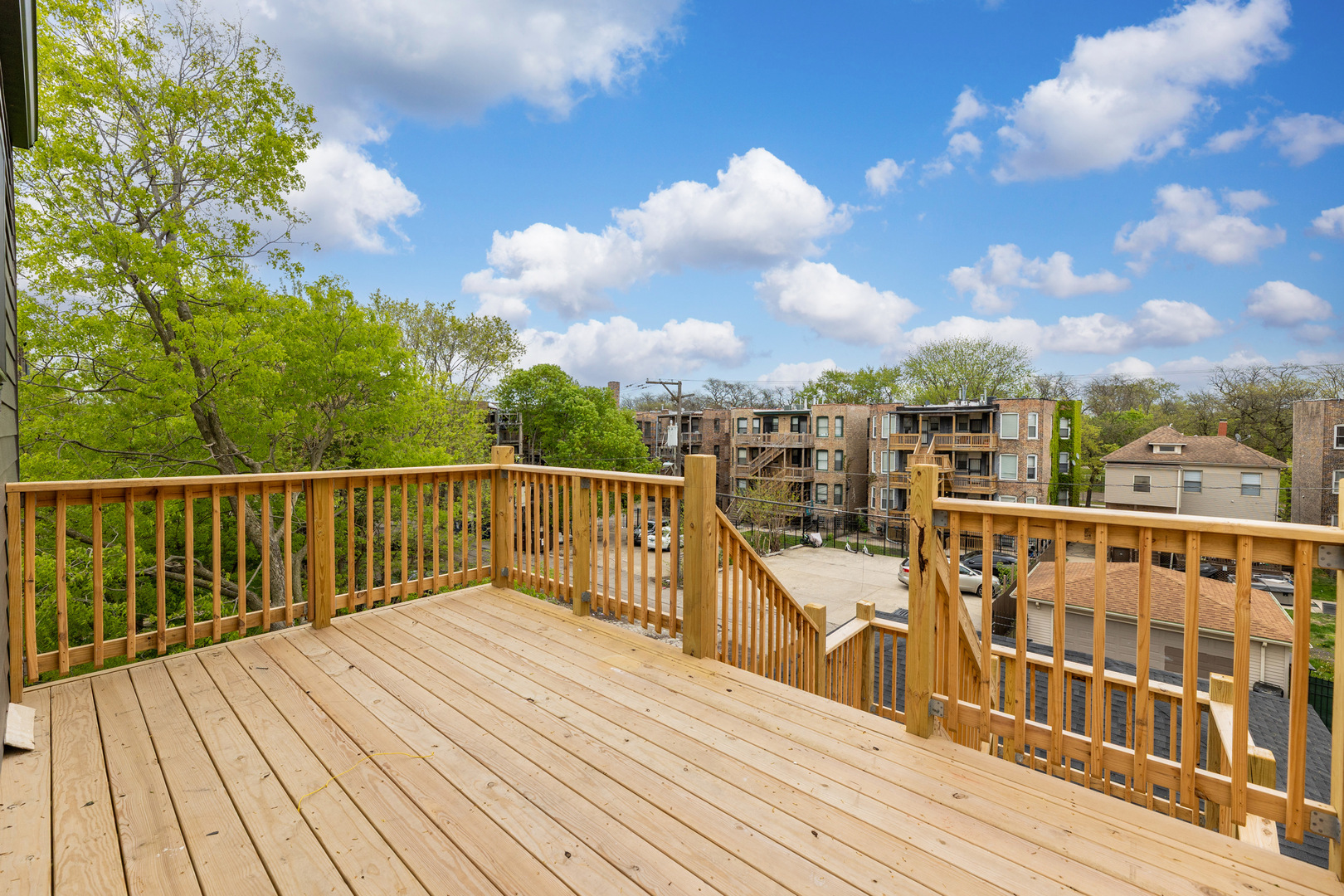 5921 South Calumet Avenue, Unit 2 Chicago, IL 60637 - Photo 34 of 40 a view of balcony with wooden floor and fence