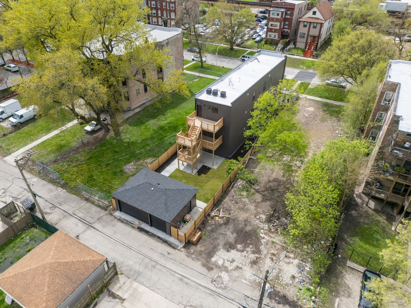 5921 South Calumet Avenue, Unit 2 Chicago, IL 60637 - Photo 38 of 40 an aerial view of a house with a garden and trees