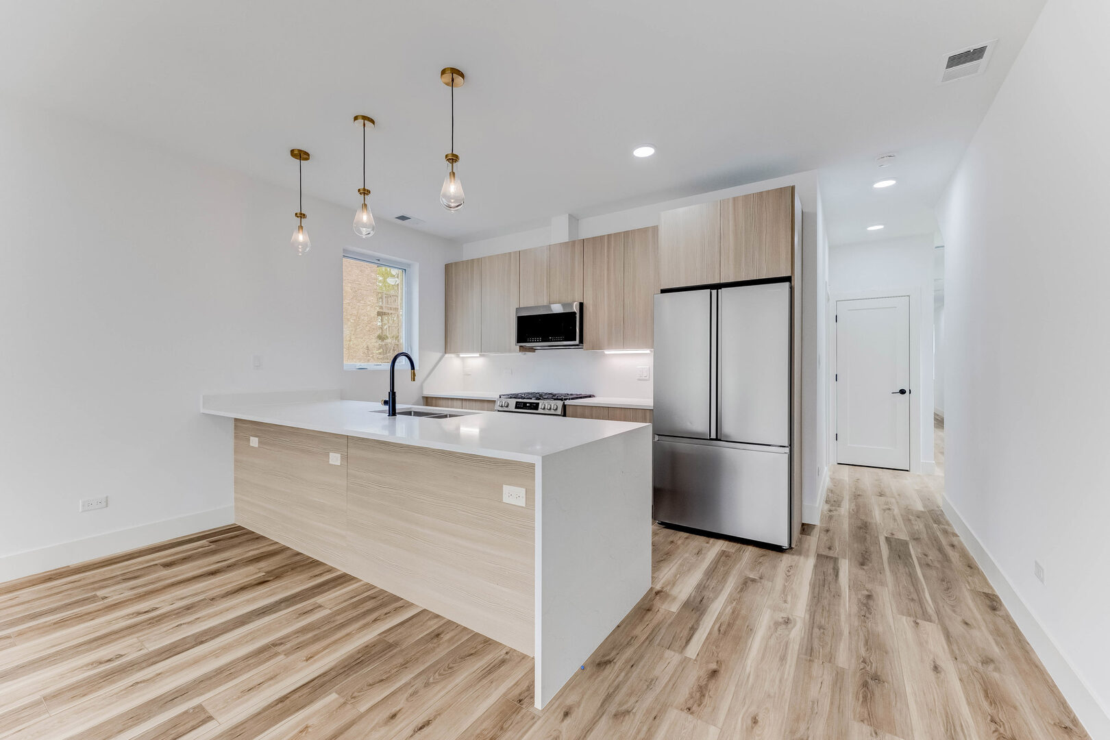5921 South Calumet Avenue, Unit 2 Chicago, IL 60637 - Photo 5 of 40 a kitchen with stainless steel appliances a refrigerator sink and microwave