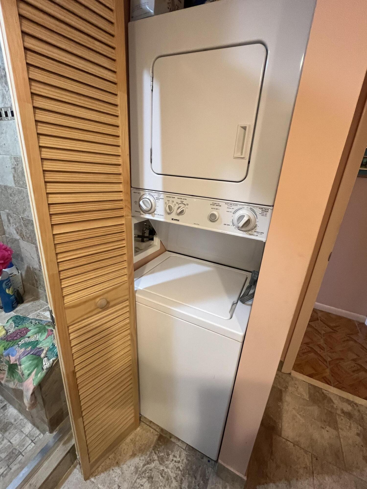 114 Capri B Delray Beach, FL 33484 - Photo 16 of 21 a utility room with dryer and washer