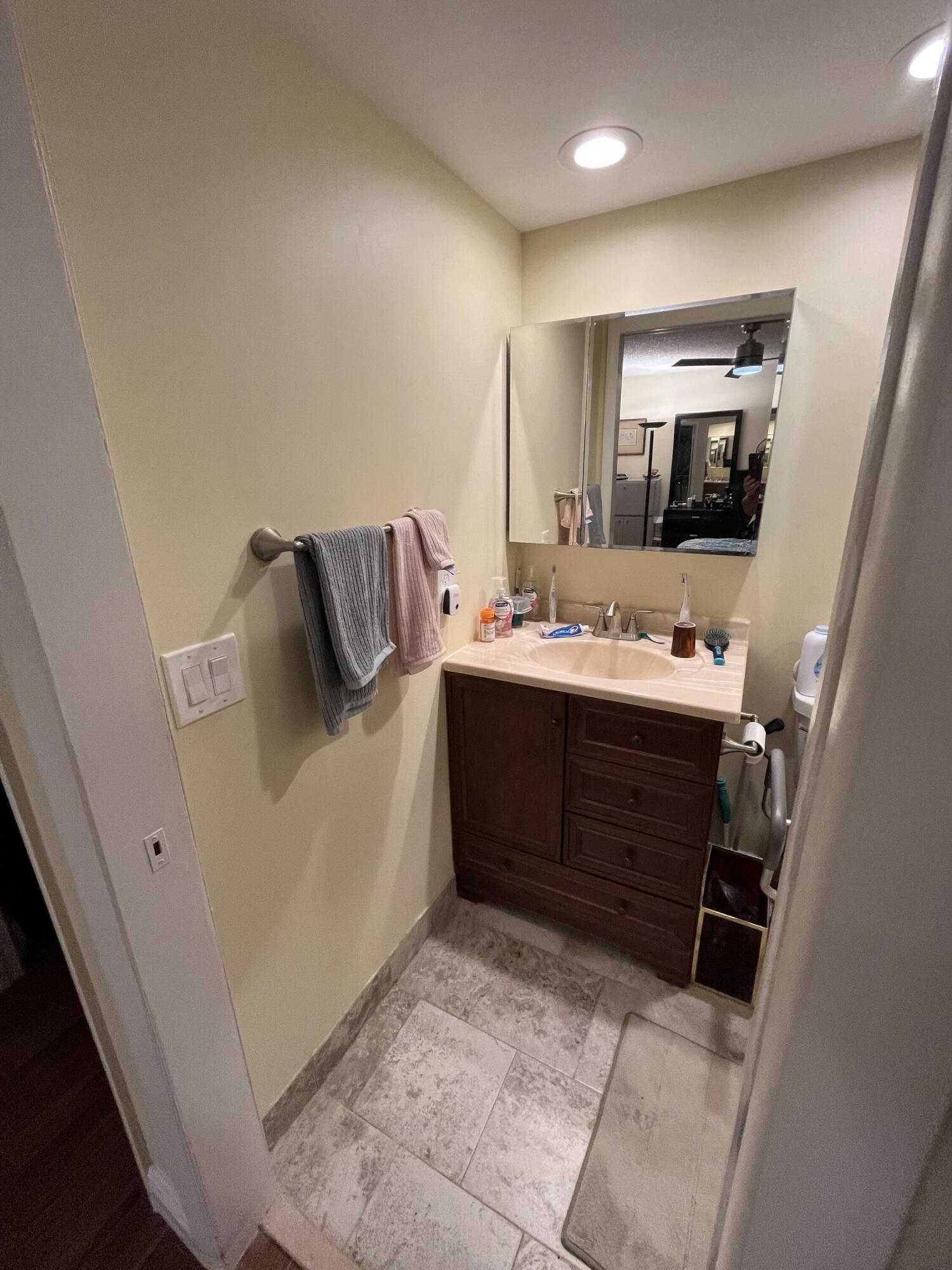 114 Capri B Delray Beach, FL 33484 - Photo 21 of 21 a room with a bed and a television