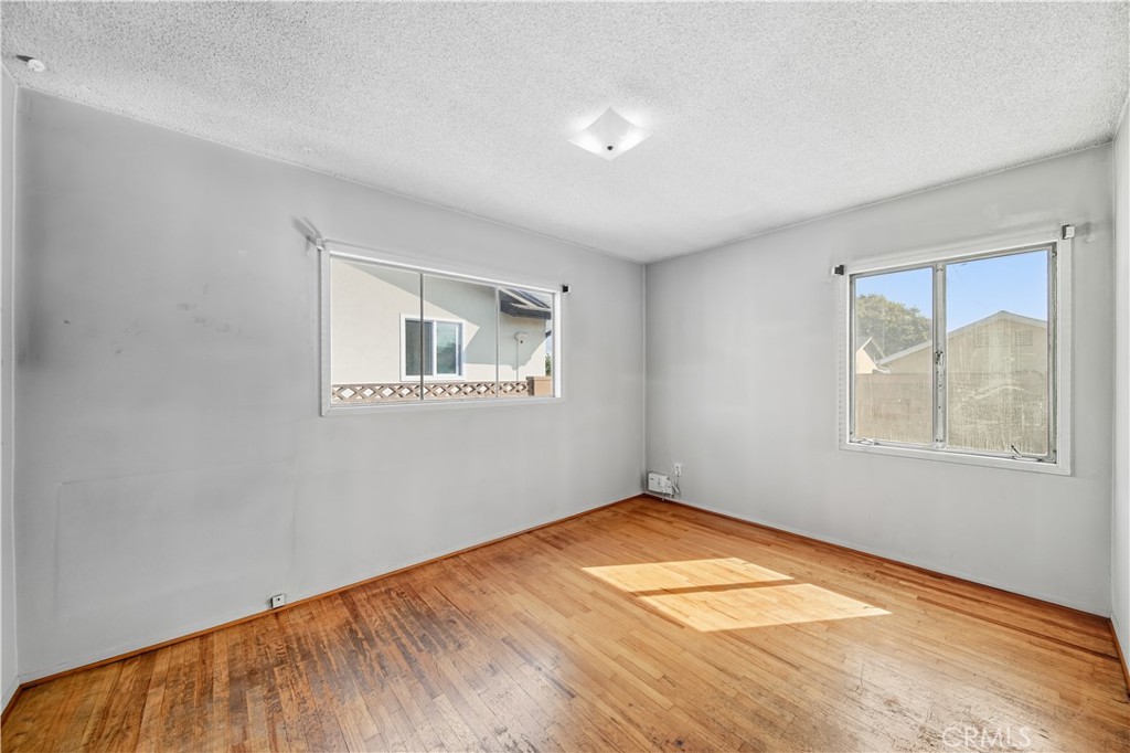 16402 Gridley Road Norwalk, CA 90650 - Photo 14 of 19 an empty room with windows