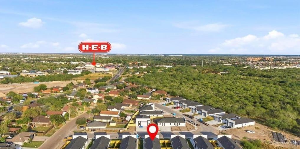 1604 Clinton Street, Unit 2 Harlingen, TX 78550 - Photo 14 of 14 Aerial overview of a residential area featuring a cluster of properties with dark roofs and light-colored exteriors